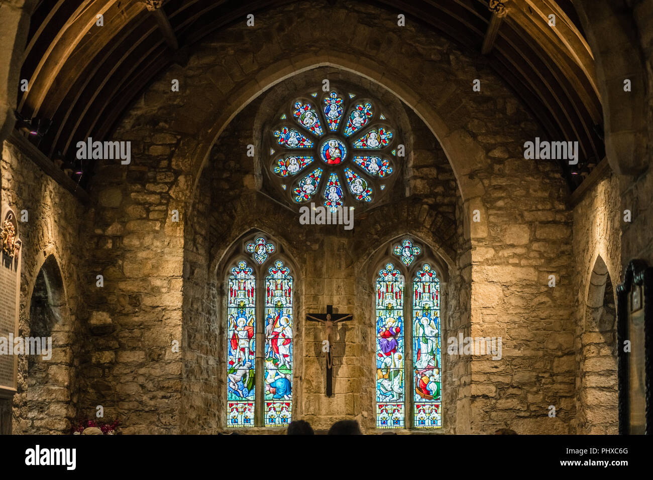 Marazion, England -  May 2018 : Victorian stained glass church window in St Michael`s Mount castle chapel, depicting saints and various religious scen Stock Photo